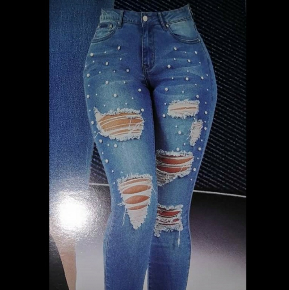 Ripped jeans with pearls. New